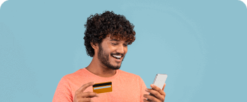 Grid Container Block For WordPress 9 happy-indian-guy-holding-cell-phone-credit-card 1